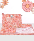 Floral-patterned pouch and sand free towel set with decorative flowers on a white background