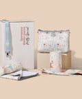 Gift set with a sand free towel and bag,  and hair turban on a beige background