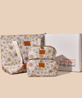 Floral-patterned makeup and toiletry bag set with a gift box bundle on a beige background